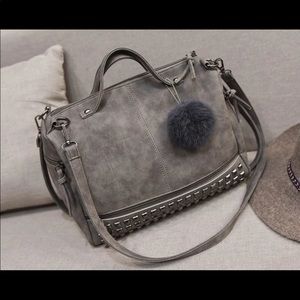 Grey cross body with pompom